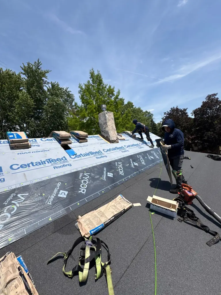 Horizon Restoration crew installing a new asphalt shingle roof on a Chicago home