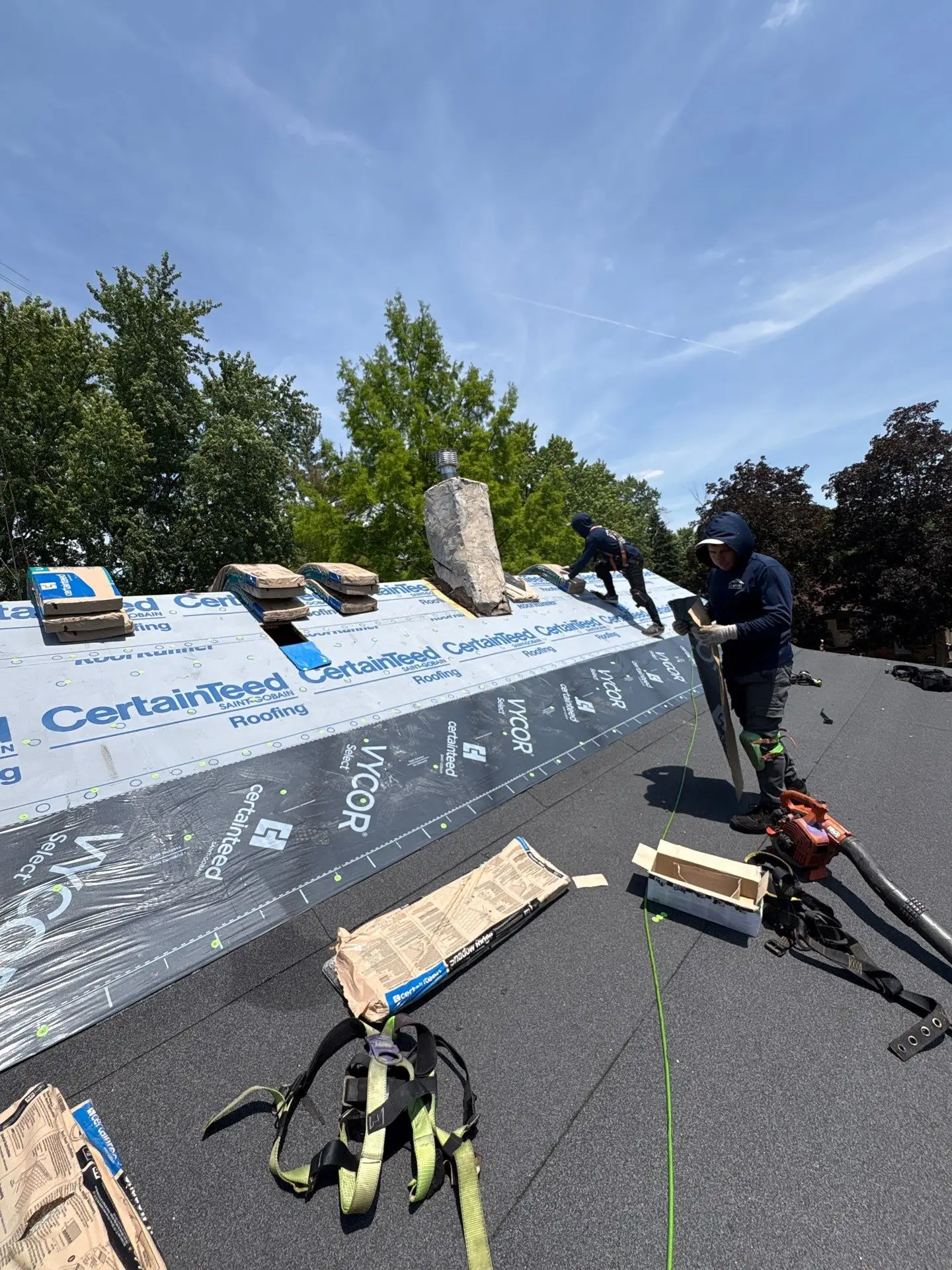 Horizon Restoration crew installing a new asphalt shingle roof on a Chicago home