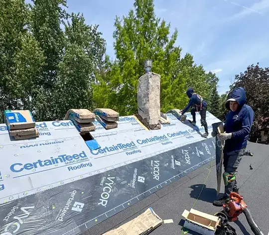 Horizon Restoration crew installing a new asphalt shingle roof on a Chicago home